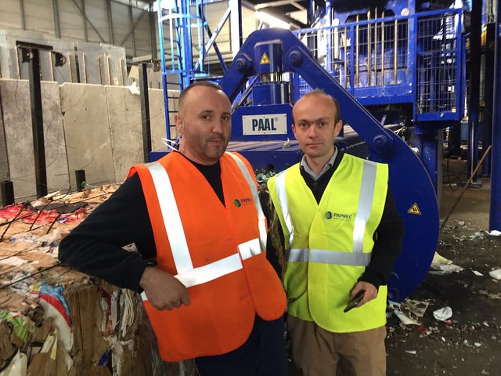 Ludovic Aberbour, COO, and Benjamin Tizon, Agency Director, Paprec Trivalo, Cote D’Azur in front of their new Kadant PAAL baler used for processing multi-materials continuously.