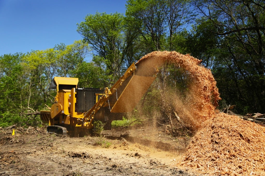 Vermeer’s HG6800TX grinder on the job processing land clearing waste.
