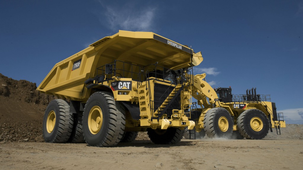 A Cat 793 being loaded by a Cat loader at a mine site.