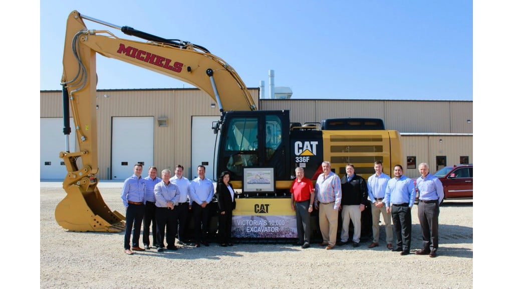 Michels receives the 10,000th machine to be produced at Caterpillar's Victoria, Texas facility. Present at the ceremony were Tyler Sternat (Fabick Cat), Kent Podobinski (Caterpillar), Chuck Riggert (Caterpillar), Art Strother (Victoria facility manager), Doug Fabick (Fabick Cat), Mary Morris (Victoria O&D Planning), Kevin Michels, Pat Michels and Terry Gassner (MICHELS Corporation), Adam Helleberg (PLM), Roger Montalvan (Victoria supply chain manager), and Craig McArton (Fabick Cat).