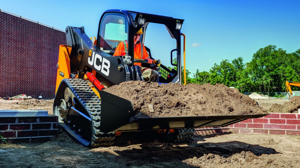 A JCB CTL carries dirt