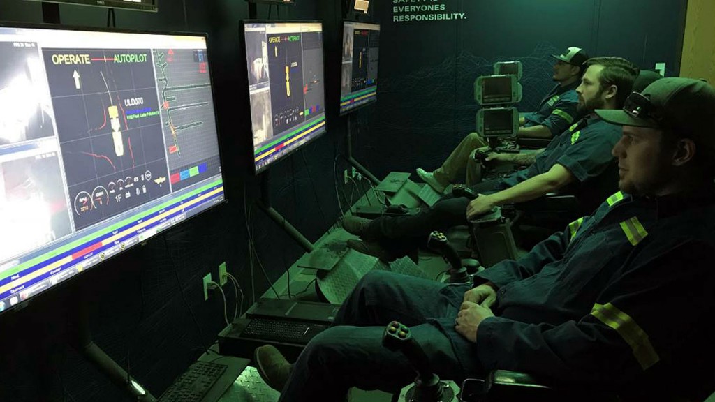 Operators of semi-autonomous underground equipment in the control room.