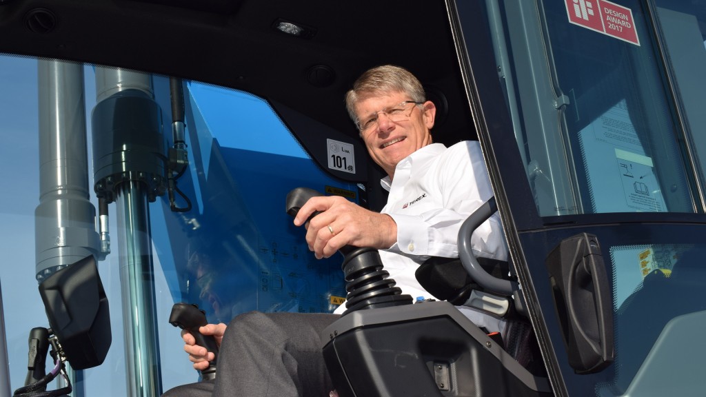 John Garrison, Terex CEO and president in Fuchs' award-winning material handler operator's cab.