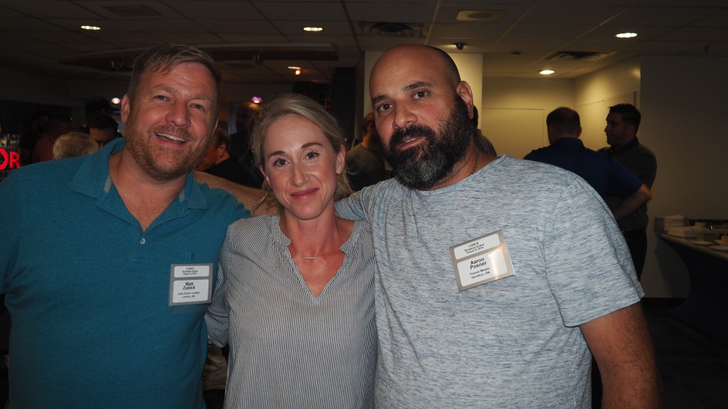 Matt Zubick (left) with CARI’s Marie Binette and Peter Racco, of Ram Iron and Metal Inc.,  a current board member, at CARI’s annual Blue Jays networking event in August.