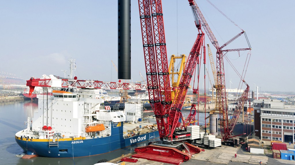 The mobile cranes are produced at Liebherr in Ehingen in a 400 metre long production hall. In the foreground the employees carry out the final assembly of the mobile crane undercarriage.