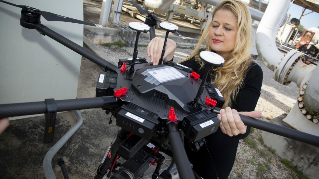 Maria Araujo inspects a drone that uses midwave infrared cameras (MWIR) to autonomously detect methane leaks. SwRI’s Smart LEak Detection System (SLED) uses computer vision and machine learning to detect pipeline leaks from aerial drones. Maria Araujo inspects a drone that uses midwave infrared cameras (MWIR) to autonomously detect methane leaks. SwRI’s Smart LEak Detection System (SLED) uses computer vision and machine learning to detect pipeline leaks from aerial drones.