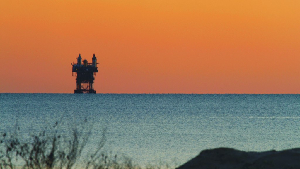 Offshore drilling rig off in the distance. Offshore drilling rig off in the distance.