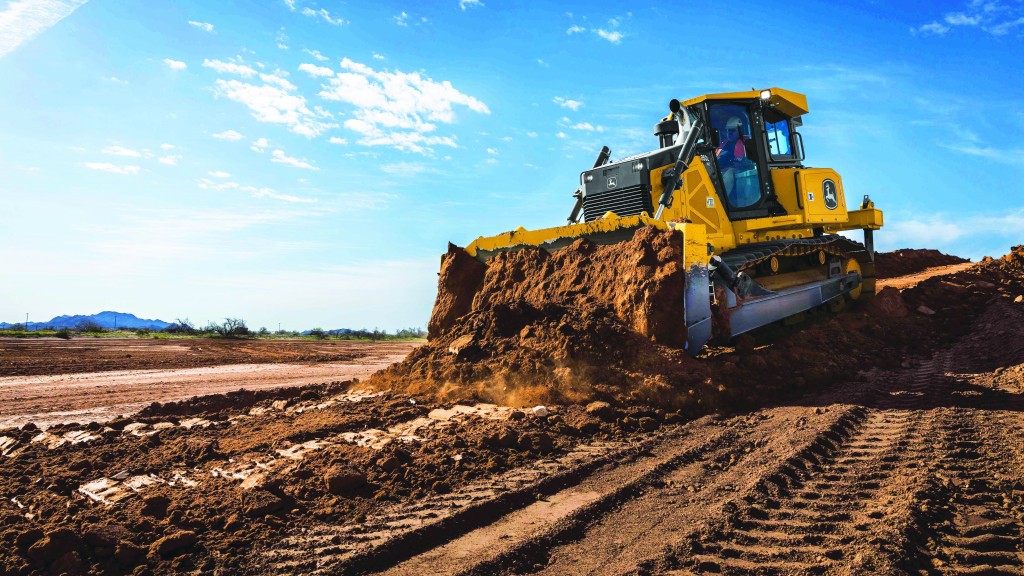 John Deere dozer pushes dirt