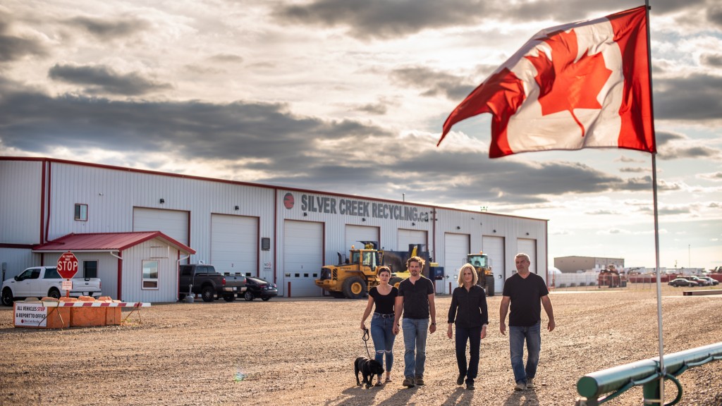 The Lubas outside their Redcliff, Alberta, scrap and auto recycling facility. From left: Merl (the dog), Amanda, Bradyn, Twila and Danny.