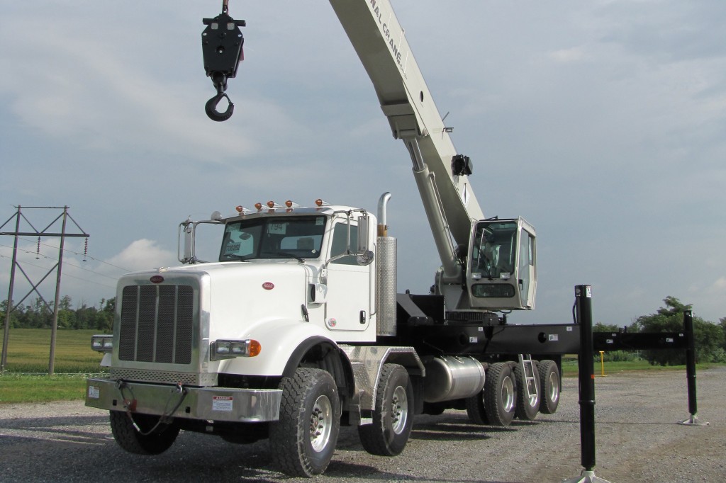 New National Crane boom truck from Manitowoc features long boom, high capacity