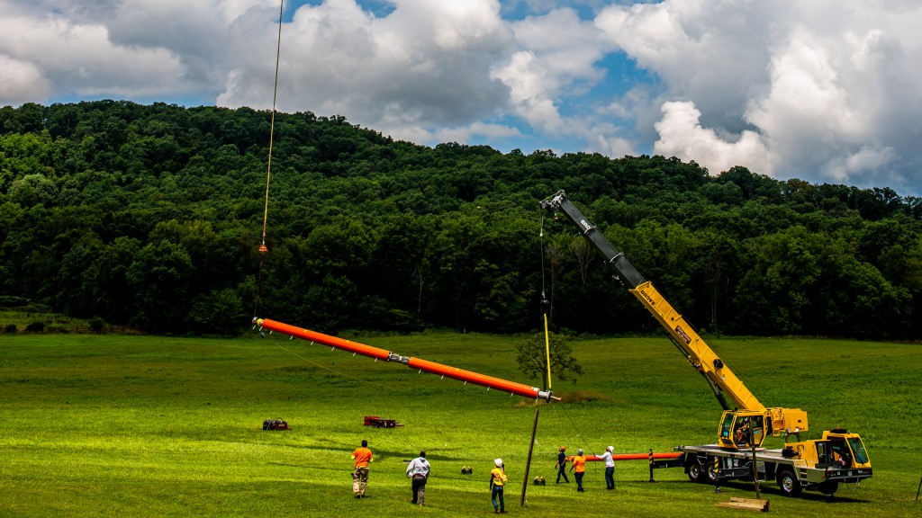 Grove crane teams up with helicopter to install antenna on radio tower