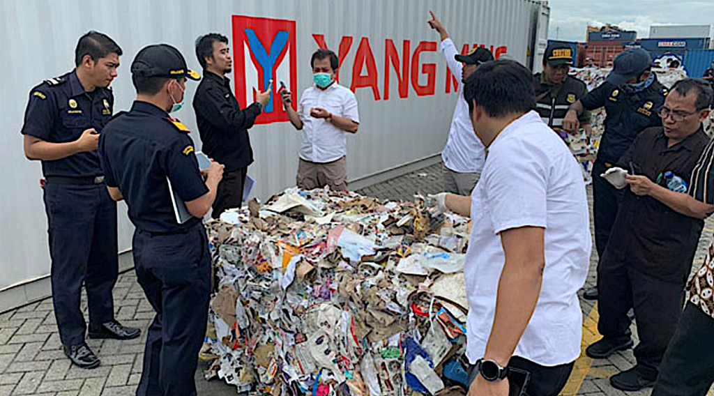 Indonesian customs officials examining seized paper waste imports contaminated with plastics and hazardous wastes. Photo by Prigi Arisandi, Ecoton 2019.