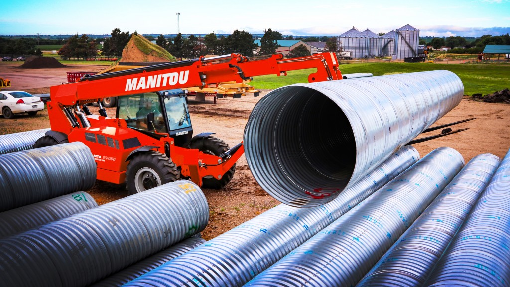 Manitou mta 12055 telehandler picking up steel tubing