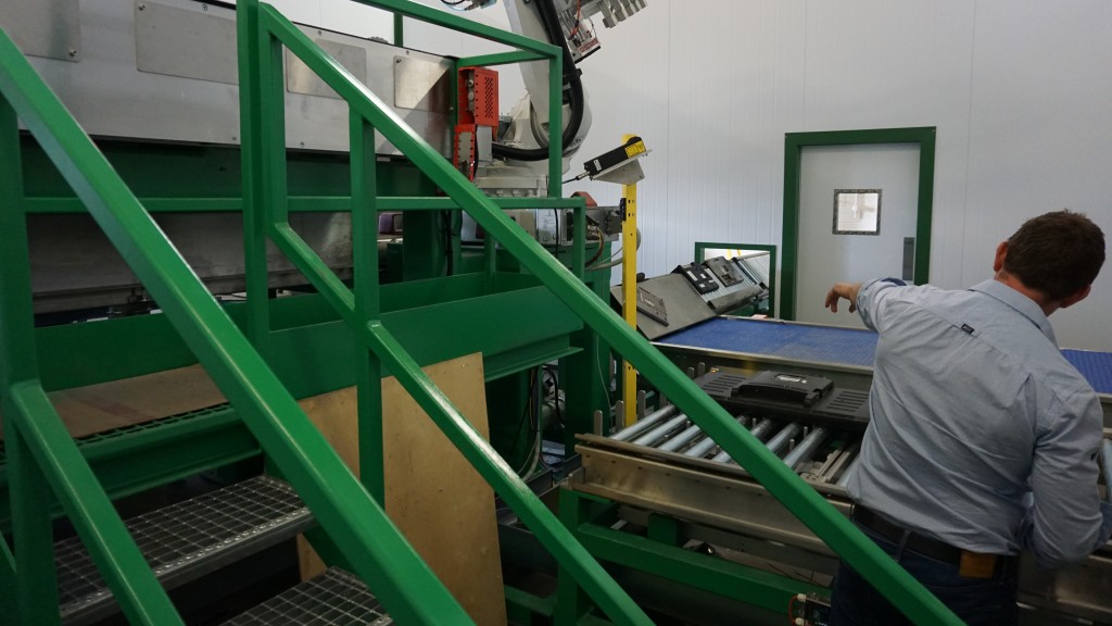 man points at recycling system