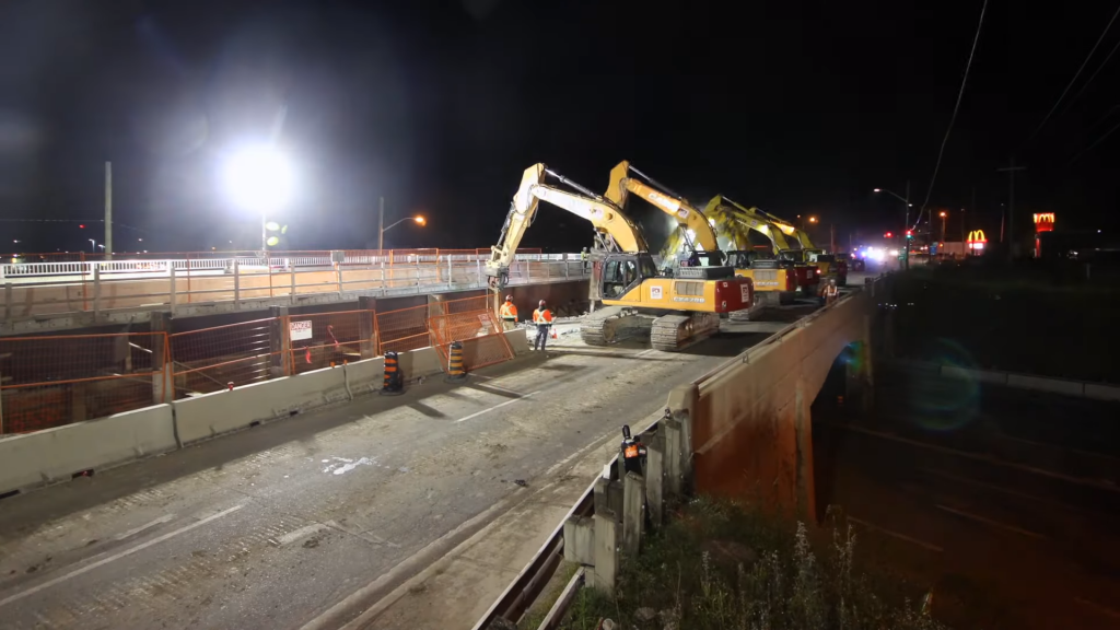 Watch Priestly Demolition take down half of the Brock Street Bridge over the 401