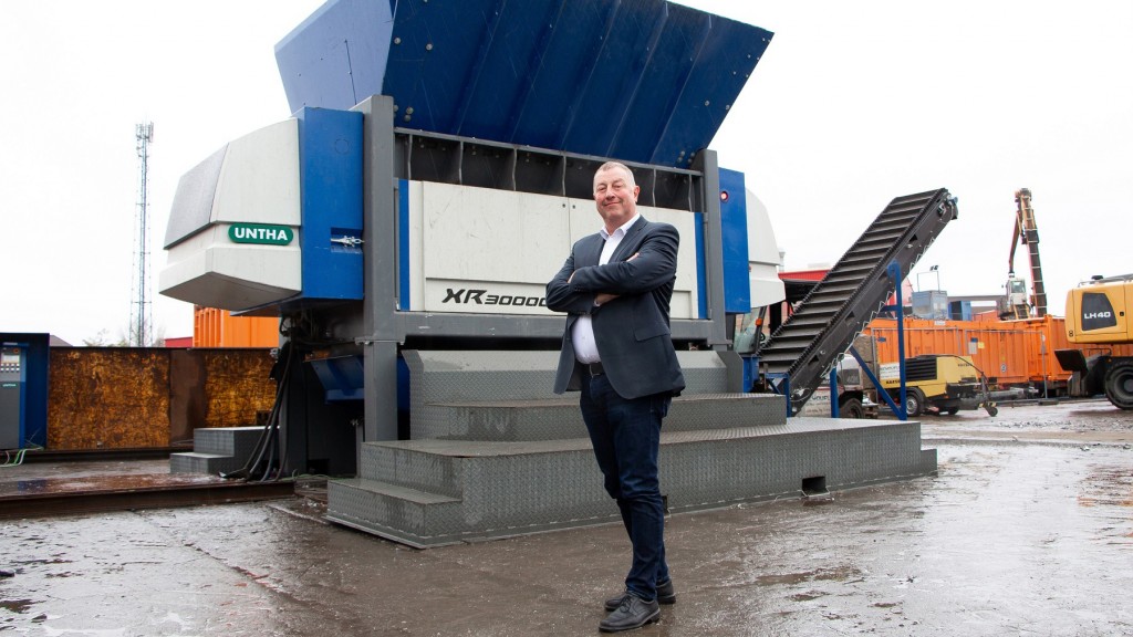 man stands in front of Untha XR3000 shredder