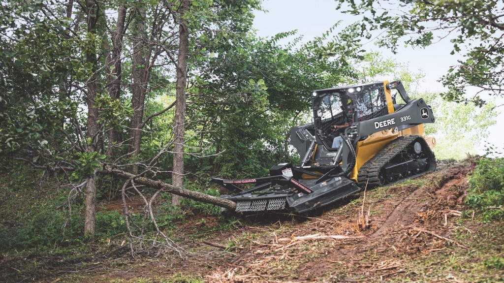 John Deere brush cutter in the forest