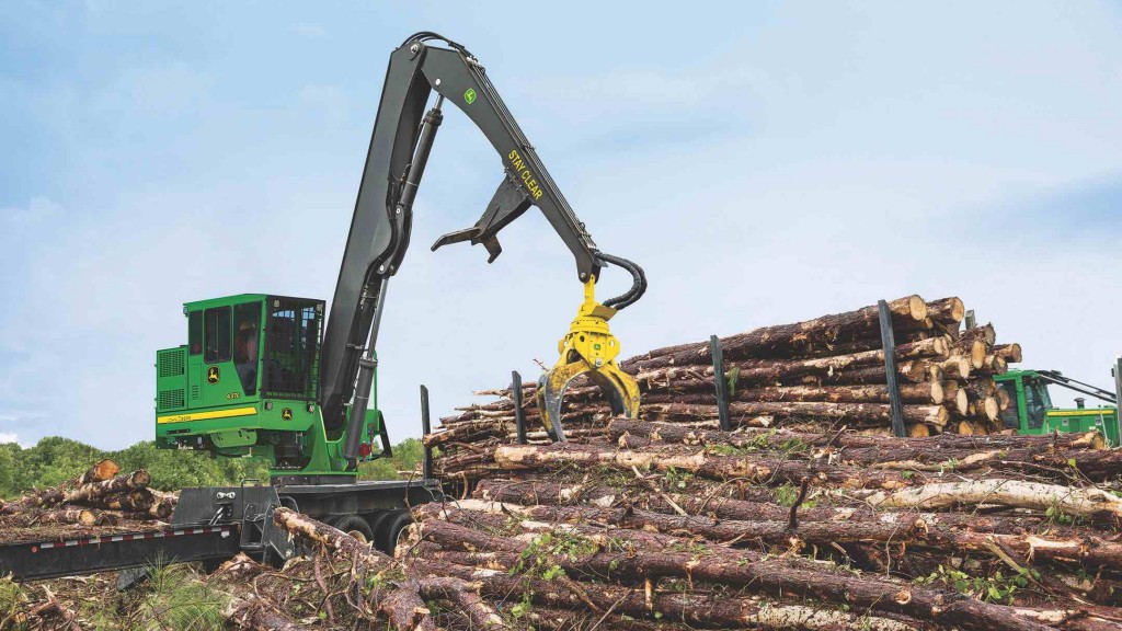 John Deere Knuckle boom loader in action