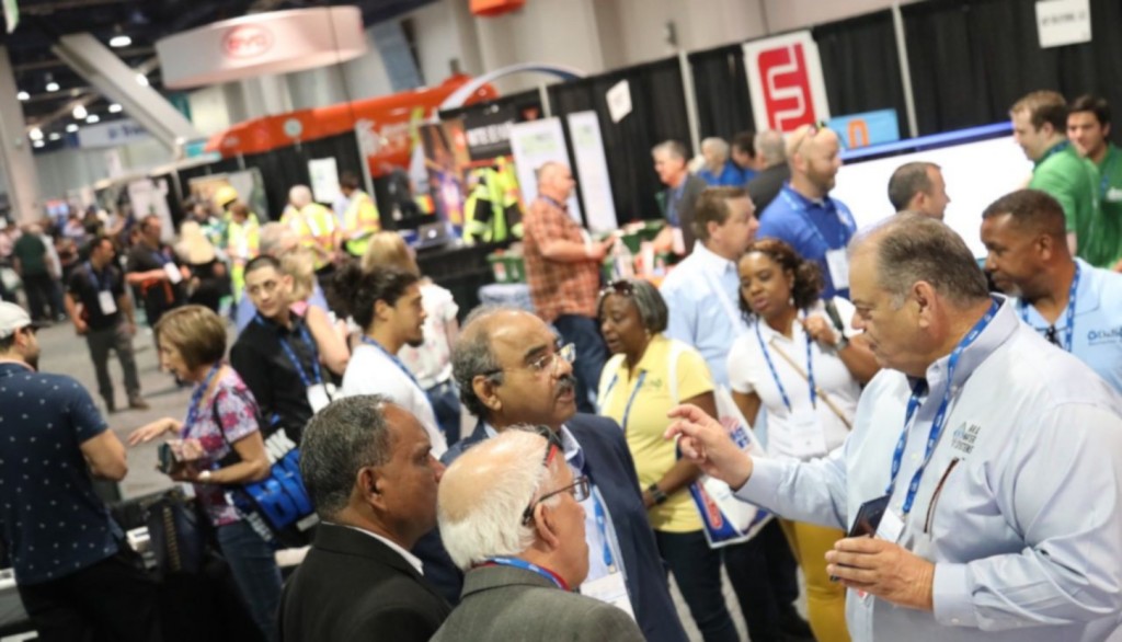 Waste Expo show floor closeup guys talking pre 2020