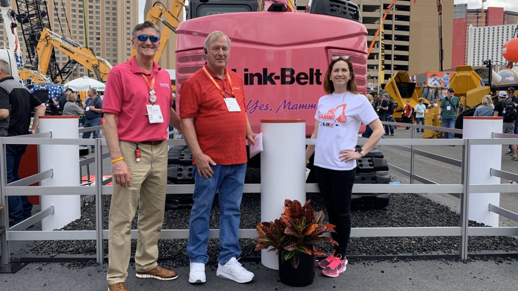 Members of LBX Company, Shafer Equipment Company and  CHI Saint Joseph Health pose in front of pink LBX machine