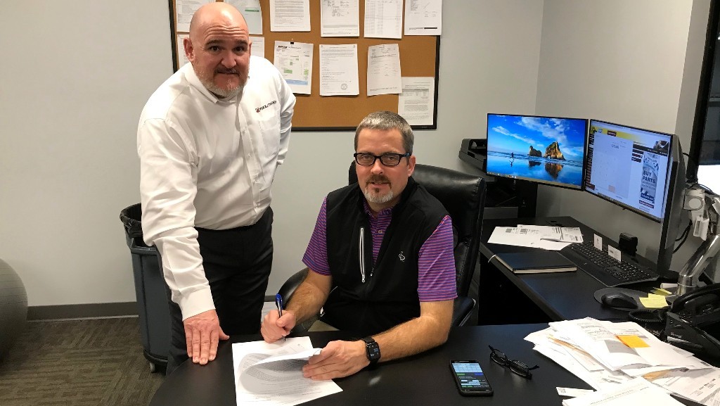 ​From left: Dan Meara, Regional Sales Manager at Terex Trucks, and Brett Arrowood, Managing Partner at Border Equipment, signed the dealer agreement.