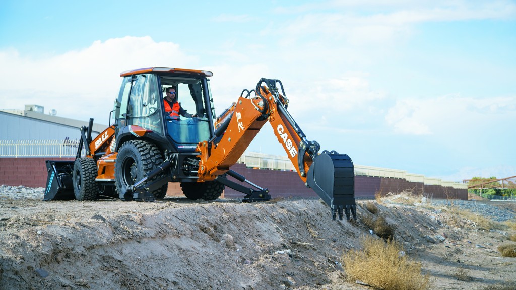 Case electric backhoe loader digging