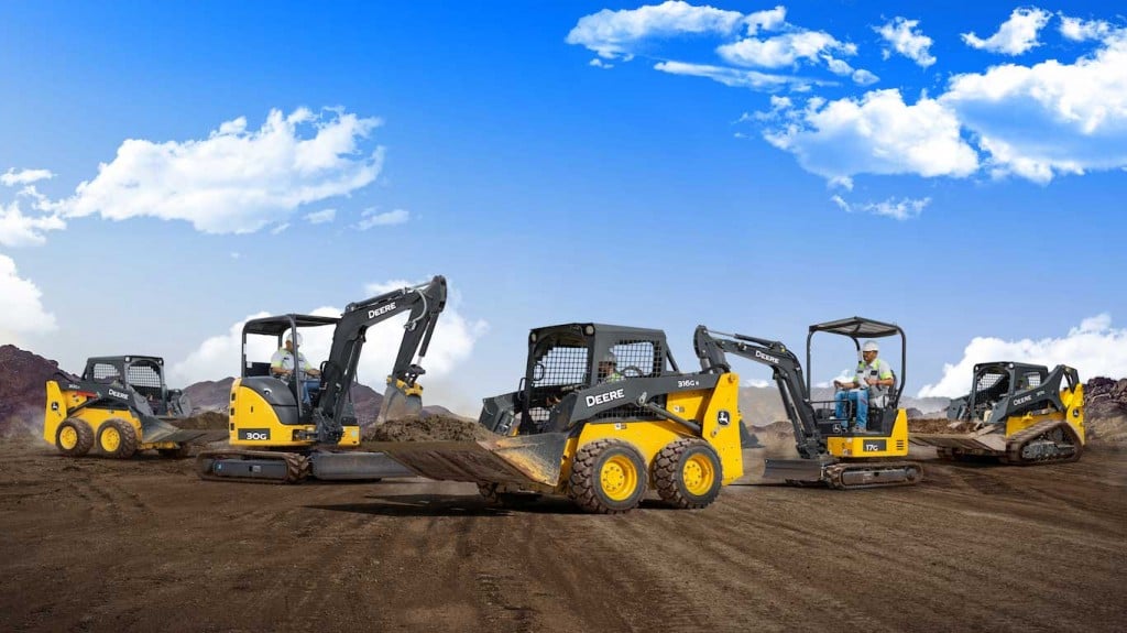 a collection of john deere machines on a site