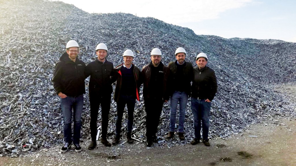 TOMRA team in front of Zorba pile