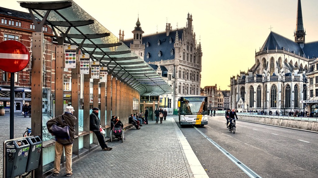 A bus approaching its stop on a road