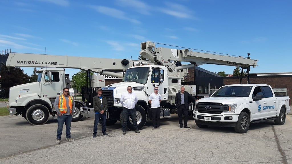 5 men from Sarens Canada and National Crane pose for picture