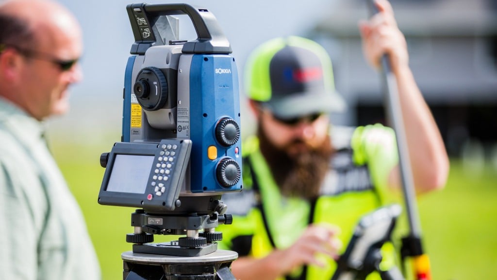 Man operates a Sokkia geospatial tool