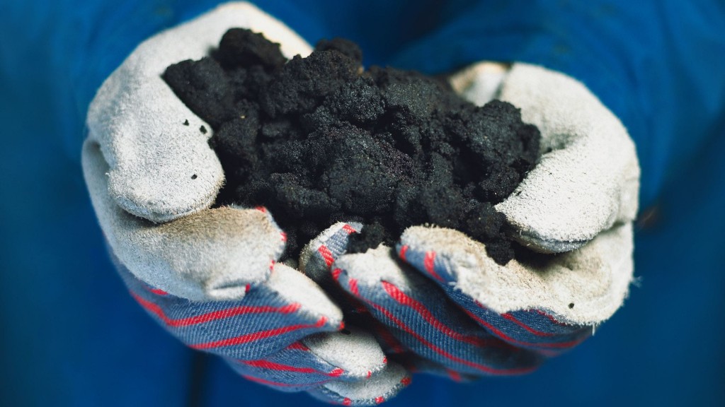 Hands holding sand containing bitumen Hands holding sand containing bitumen