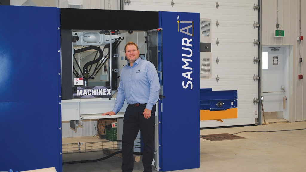 Machinex’ Matthew Smith with a newly installed SamurAI sorting robot, charged with processing waste and recyclables at the Hong Kong airport.