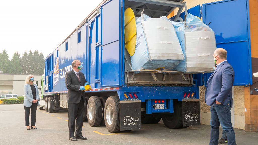 Della Bond (FortisBC), Minister Ralston and Allen Langdon (Return-It) operating a CNG Truck.