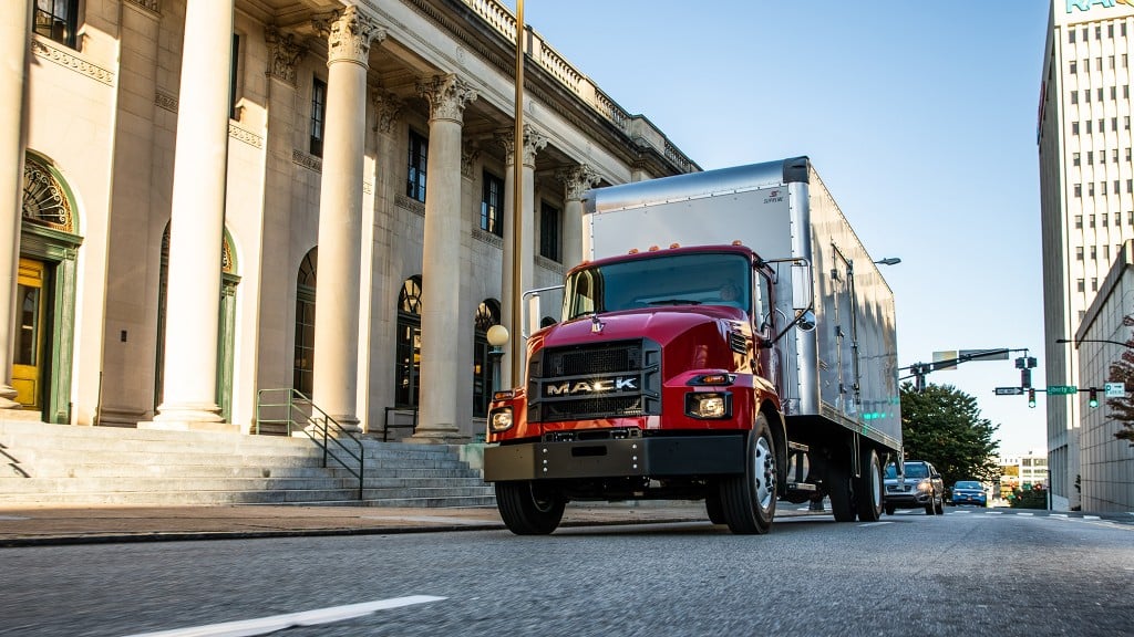 Mack MD series drives down city street