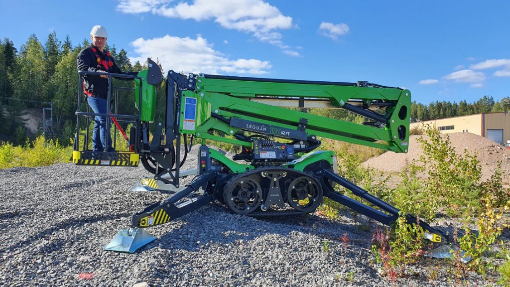 man operating a Leguan lift in a field