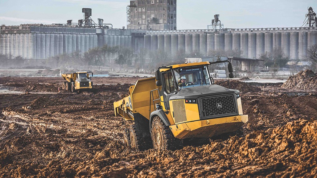 John Deere ADT drives through muddy terrain