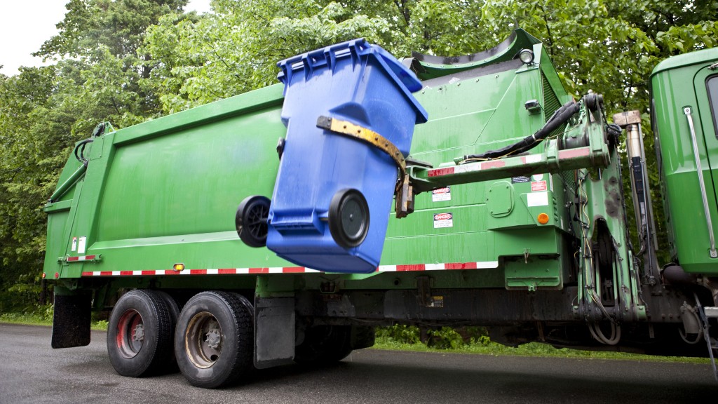 collection truck loading a blue bin in to the truck body