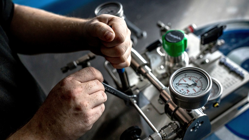 technician works with a wrench technician works with a wrench