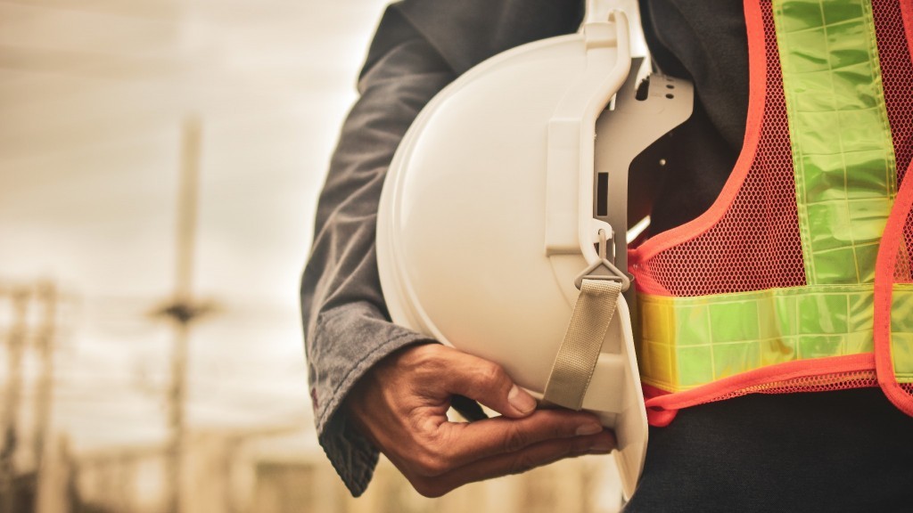 worker holding a hard hat