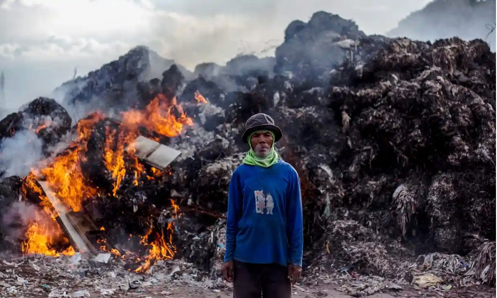 Burning illegal waste dump in Indonesia