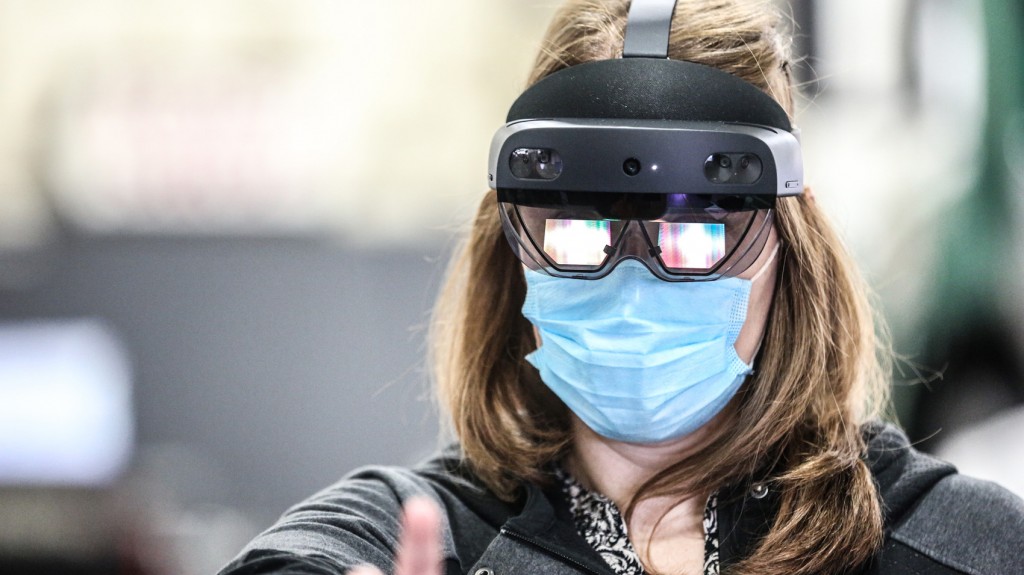 woman wearing a facemark and a HoloLens