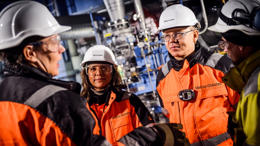 metso Outotec workers with hard hats on at a facility