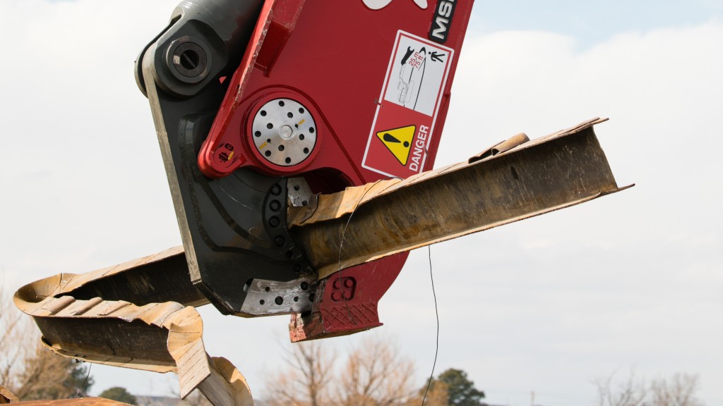 LaBounty shear picking up a piece of scrap metal