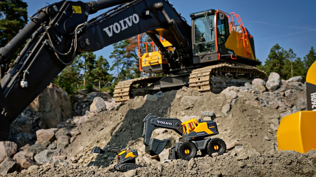 a volvo machines dwarfs a toy version of itself