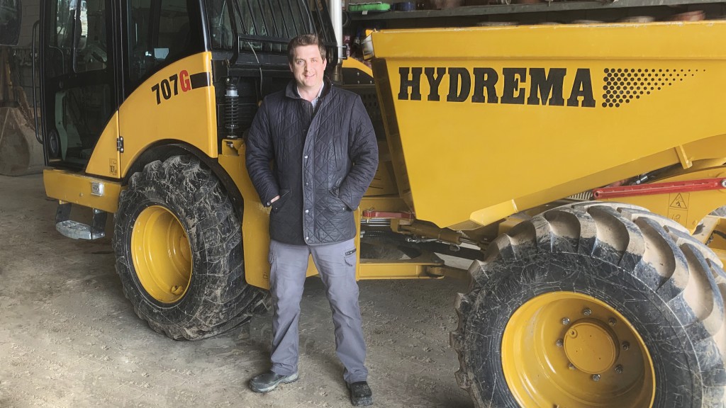 man stands in front of Hydrema machine