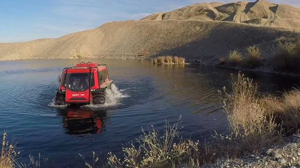 fat truck amphibious vehicle in a pond