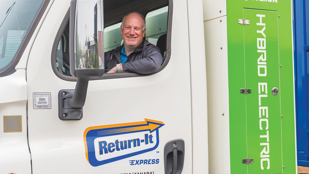 Return-It president and CEO, in a Hyliion compressed natural gas (CNG) hybrid-electric compaction truck, a first in Canada, and which has been part of a pilot in B.C. since fall 2020.