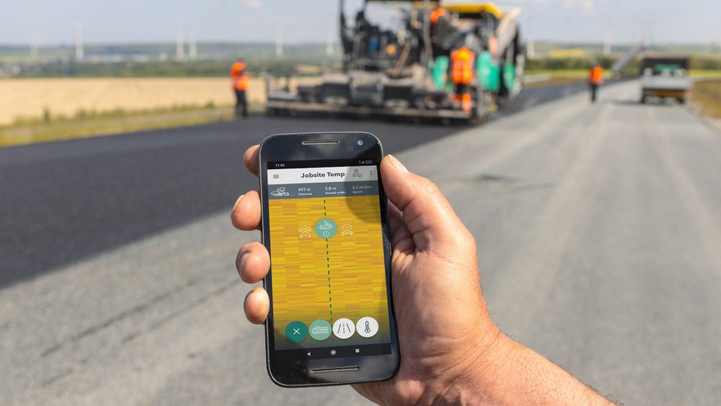 A worker uses the Jobsite Temp app