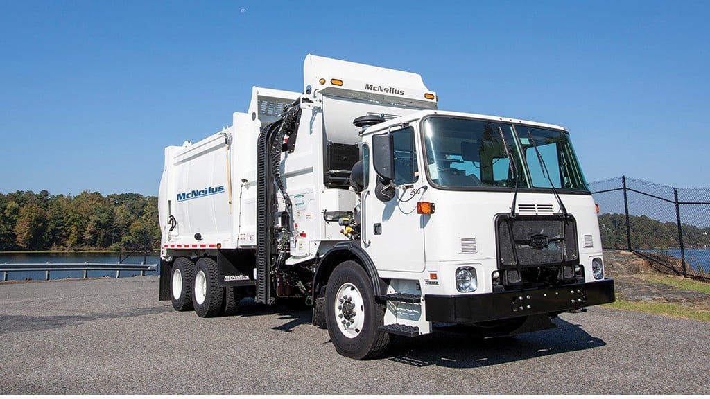 McNeilus side loader collection truck parked on a road